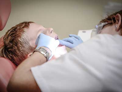 Dentist working on child 